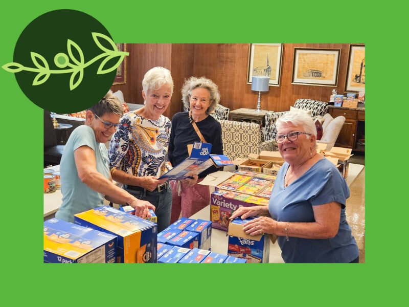 Women packing food for outreach program